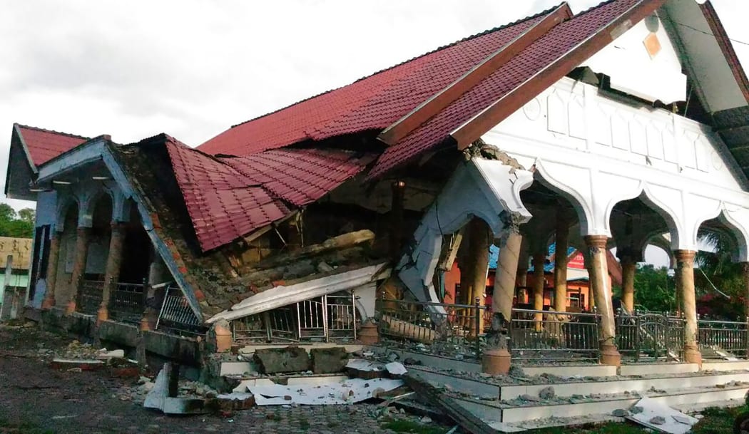 A badly damaged building is seen after a 6.4-magnitude earthquake struck the town of Pidie, Indonesia's Aceh province in northern Sumatra, on 7 December, 2016.