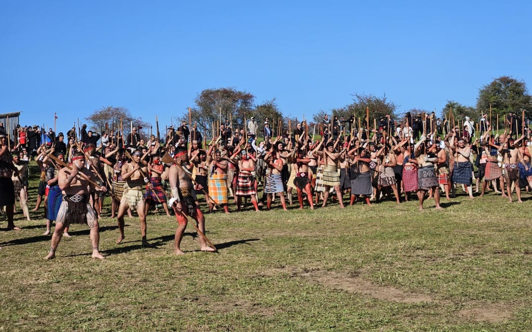 Members of Te Aka Rauwhero welcome Government representatives to Ōrākau.