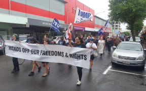 About 200 protesters marched up Devon Street on 4 December, calling on the government to end the vaccine mandate.