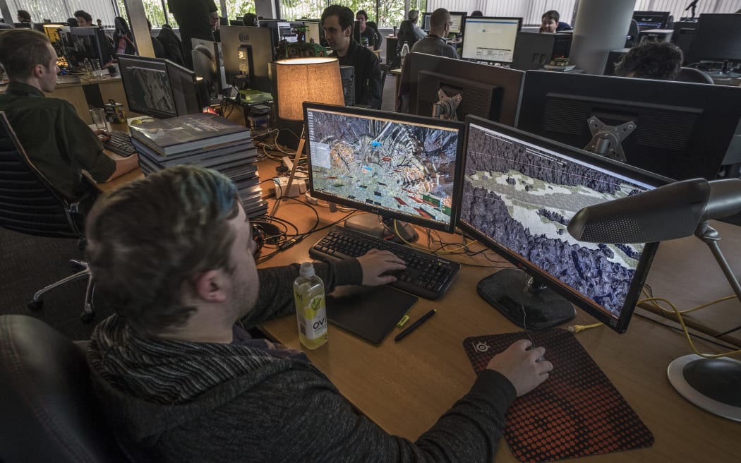 A programmer works on Grinding Gear Games' Path of Exile in their Henderson office which is the first PC game made by New Zealanders which will be launched on the Xbox platform.