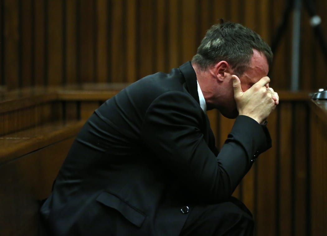 A disraught Oscar Pistorius apologised to Reeva Steenkamp's family.