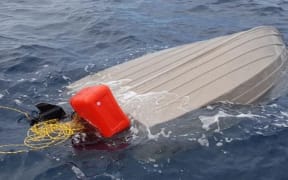 The boat was found capsized off Port Waikato.