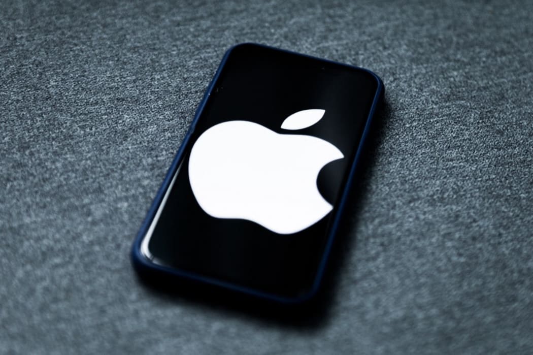 Apple logo displayed on iPhone screen is seen in this illustration photo taken in Poland on February 8, 2021. Facebook reacted negatively to Apple's privacy policy changes.