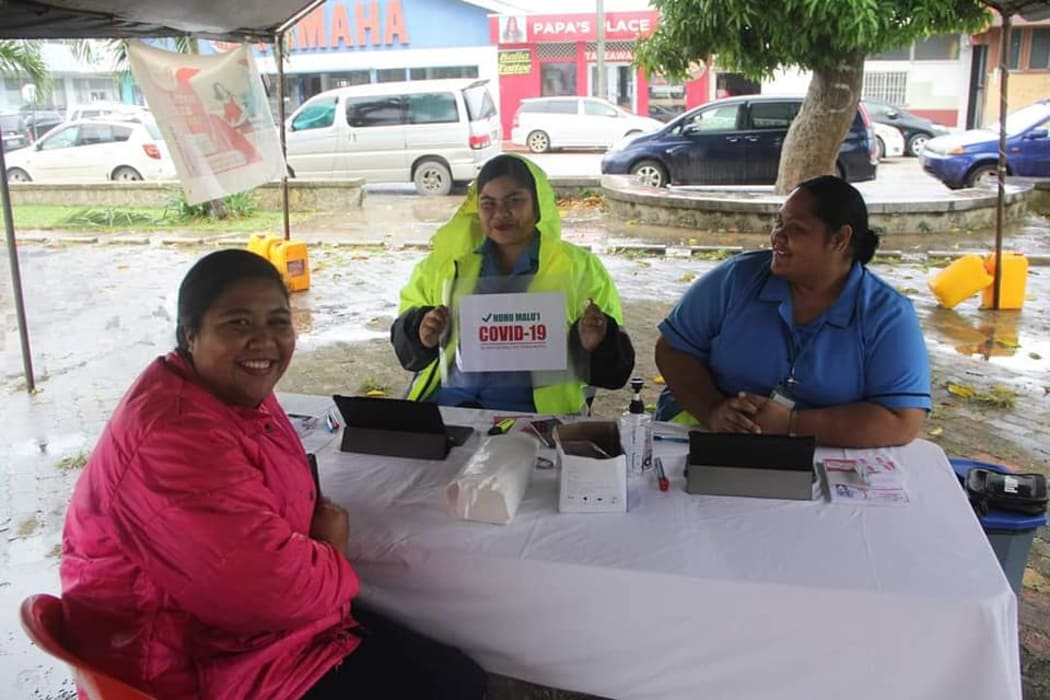 Health workers offering Covid-19 vaccinations in Tonga.