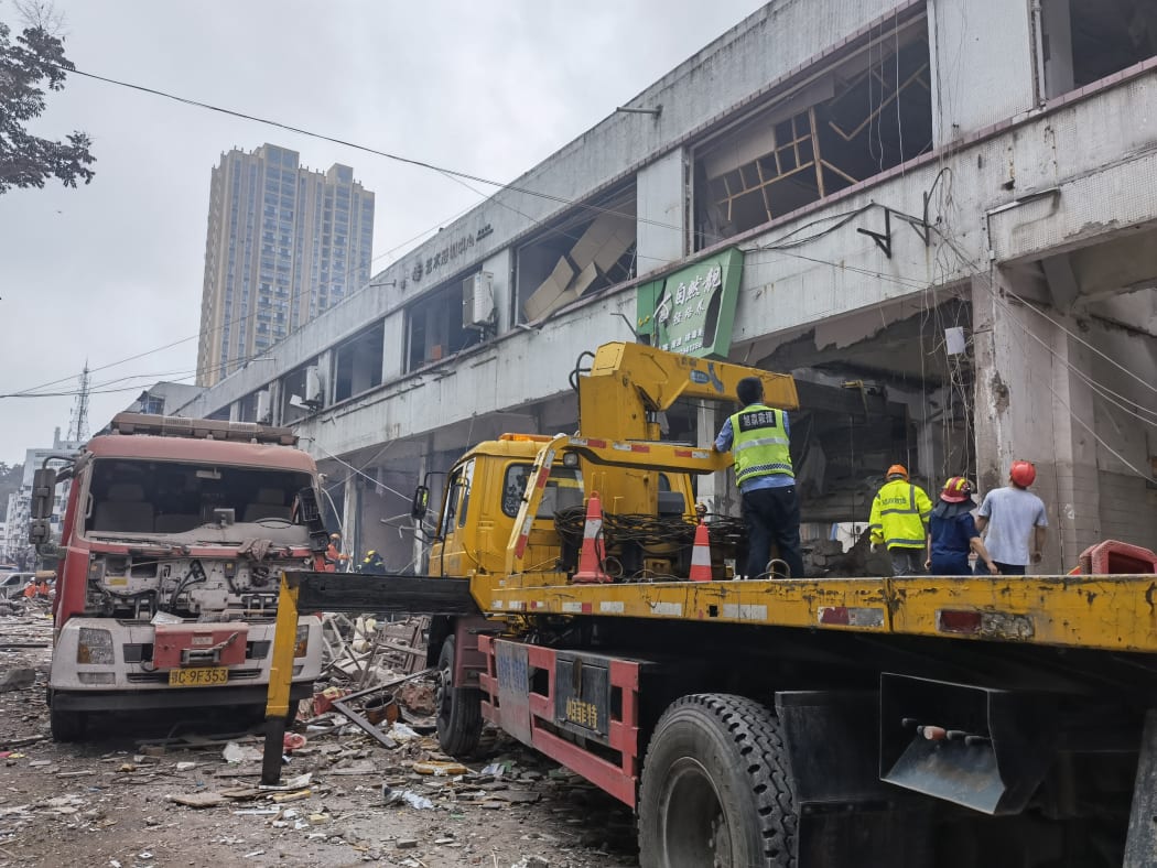Rescuers work at a gas pipe explosion site in Yanhu Community of Zhangwan District in Shiyan City, central China's Hubei Province, June 13, 2021.