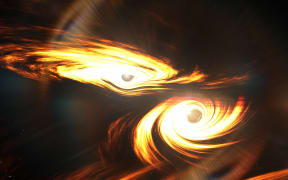 Artist’s impression of binary black holes about to collide.