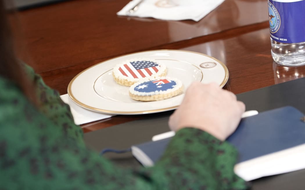 Cookies with the US and Australian flags are seen as US Defense Secretary Pete Hegseth meets with Australian Deputy Prime Minister and Defense Minister Richard Marles for talks at the Pentagon in Washington, DC, on February 7, 2025. (Photo by oliver contreras / AFP)