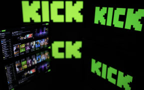 This photograph shows screens displaying the logo of the Australian live-streaming platform Kick, in Toulouse, southwestern France on August 21, 2025.