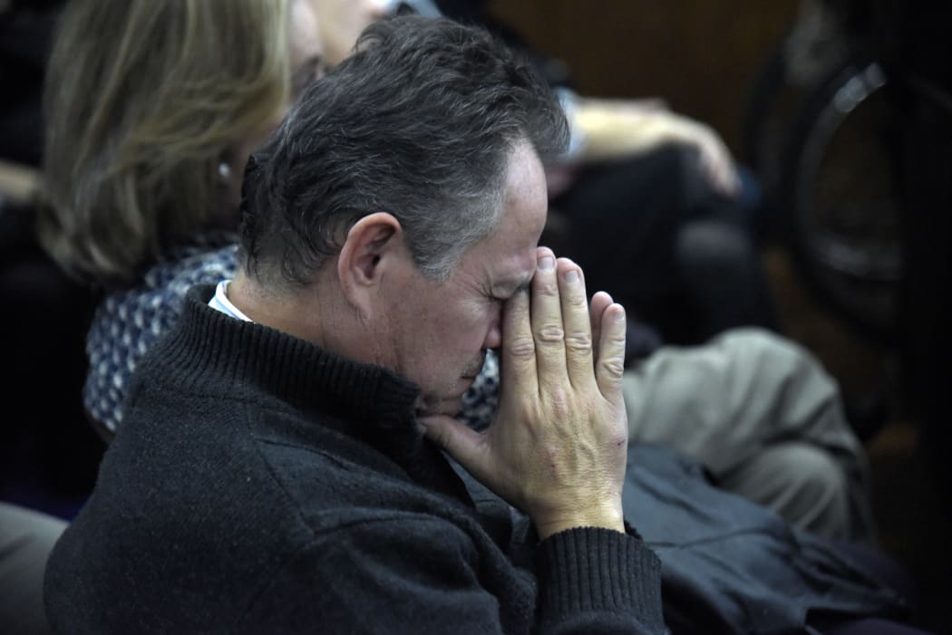 Relatives and victims of Argentine and Paraguayan military dictatorships hear the sentence of Argentina's court in the trial on Operation Condor, at the Argentina's embassy in Asuncion on May 27, 2016.