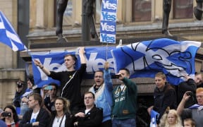 Pro-Independence supporters demonstrate in Glasgow on the eve of Scotland's independence referendum.