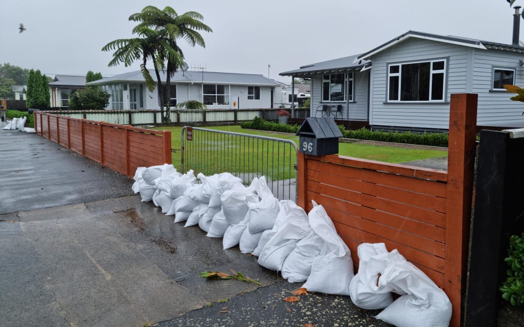 Sandbags stacked up at Derby Street, where residents prepare to evacuate as heavy rainfall threatens to flood the area.