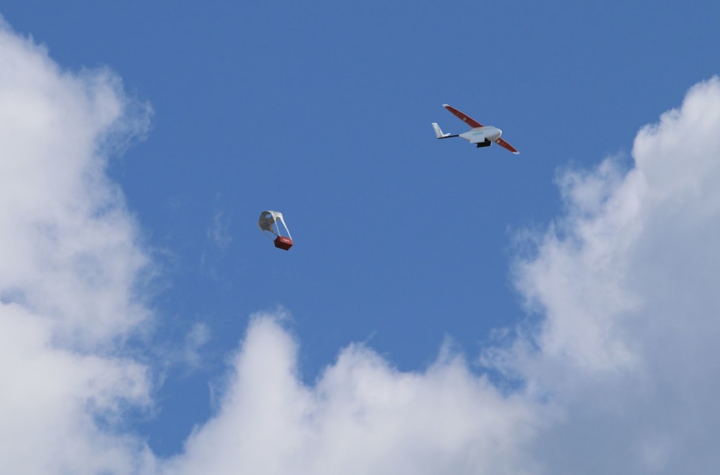 A Zipline drone dropping off medical supplies