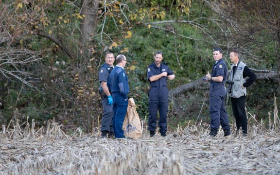 Police at the banks of the river.