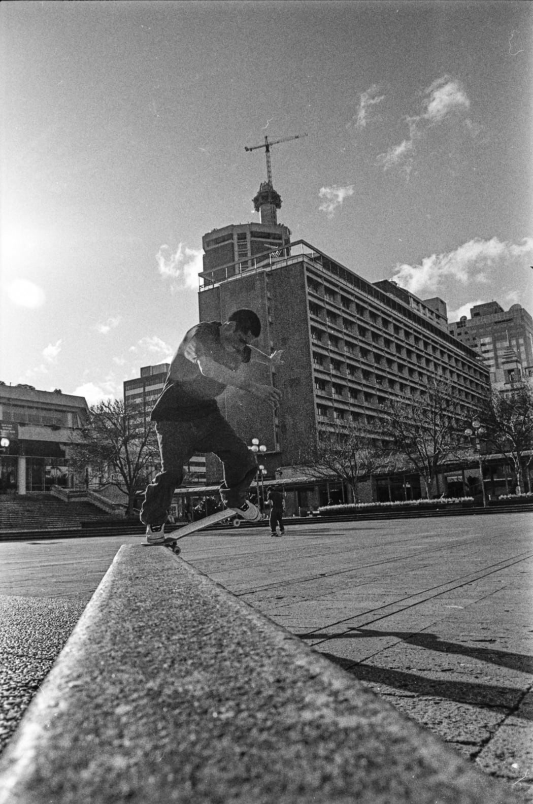 Boardslide as the Sky Tower goes up in the background.