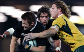Michael Hooper tackles Richie McCaw, 2014.