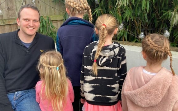 John Hardern with his four daughters