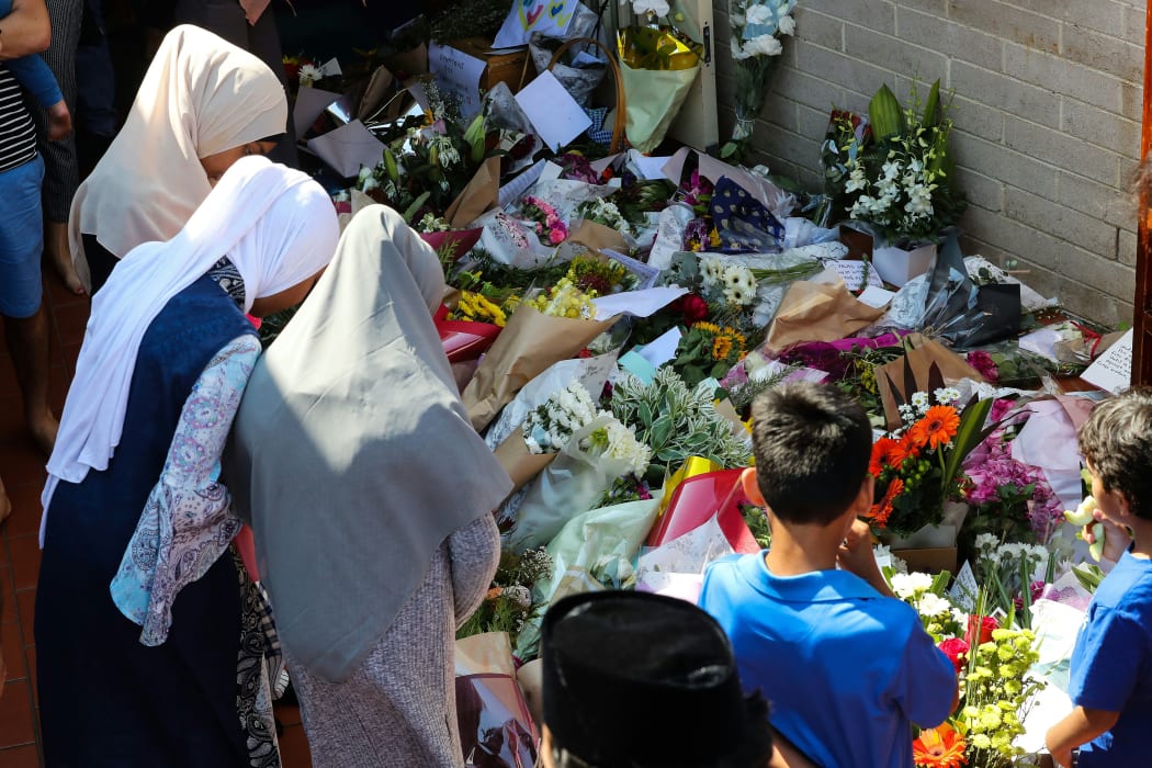 Locals their respects for the Christchurch terror attack victims and place flowers during an Open Day at Preston mosque in Melbourne on March 17, 2019.