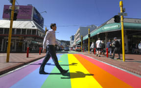 Wellington Major Justin Lester crossing the new rainbow crossing, Cuba Street in Wellington.