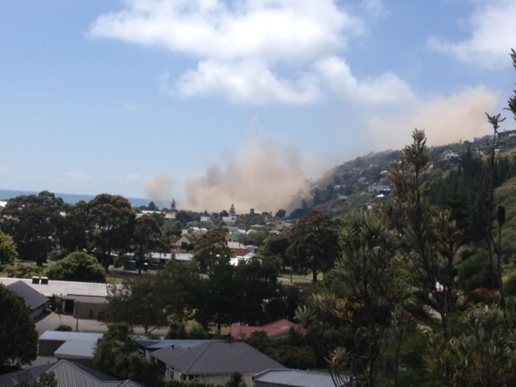 Dust rise seconds after a cliff collapsed in the 5.7 earthquake in Sumner, Christchurch