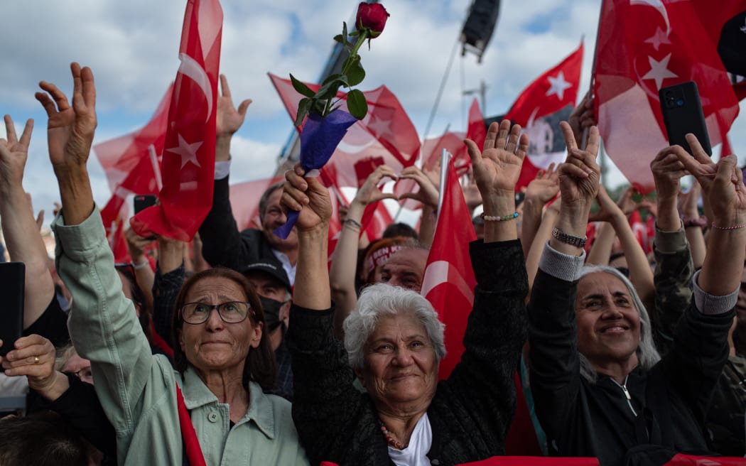 Supporters of the main opposition Republican People's Party (CHP) wave flags during an election rally, ahead of the 28 May presidential runoff vote, in Istanbul, Turkey. 27 May, 2023.