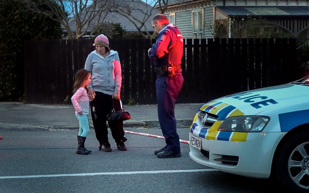 A mother and daughter living close to the scene ask to be let back in their home inside the cordon.