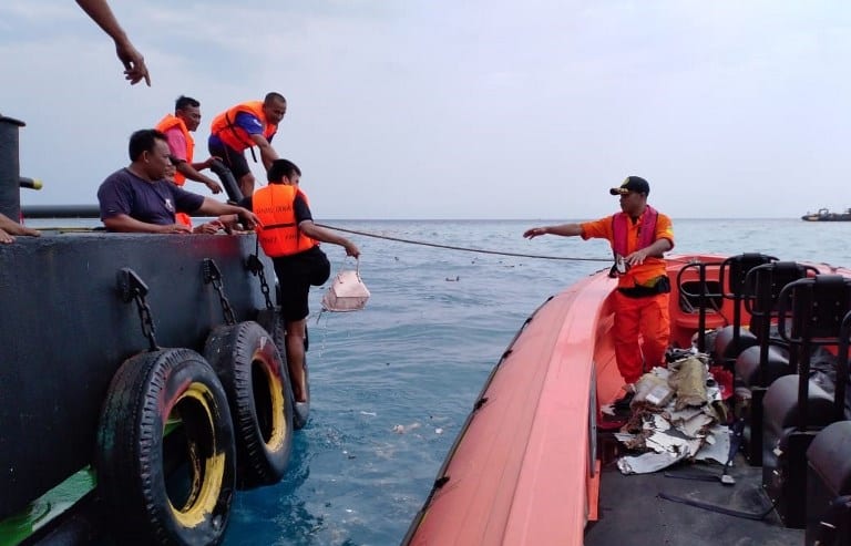 A National Search and Rescue Agency team preparing to search the crash area.