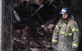 The majestic edifice stood engulfed in flames as plumes of smoke shot into the night sky, while firefighters battled to control the blaze that erupted.