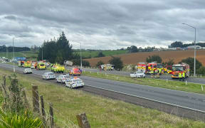 Emergency services at the scene of a horror crash on Auckland's State Highway 1 near Ramarama on 26 August 2024.