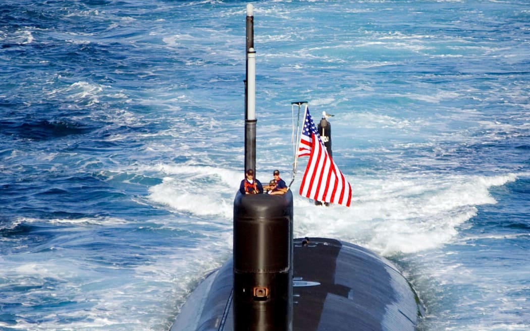 The Los Angeles-class attack submarine USS Tuscon (SSN 770) transits the East Sea while leading a 13-ship formation.