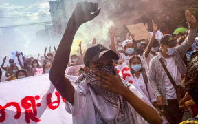 Protesters take part in a demonstration against the military coup in Yangon on July 3, 2021.