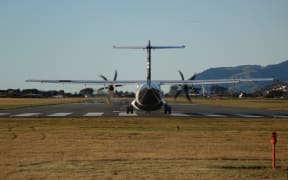 An Air New Zealand turboprop plane prepares for takeoff from Nelson Airport.