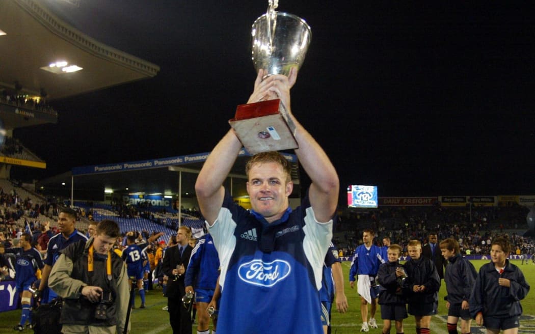 Xavier Rush holds the trophy after leading the Blues to the 2003 Super 12 title. 24 May 2003. Super 12 Final. Eden Park, Auckland, New Zealand. Blues vs Crusaders.

The Blues won the match, 21 - 17.
Pic: Sandra Teddy/Photosport