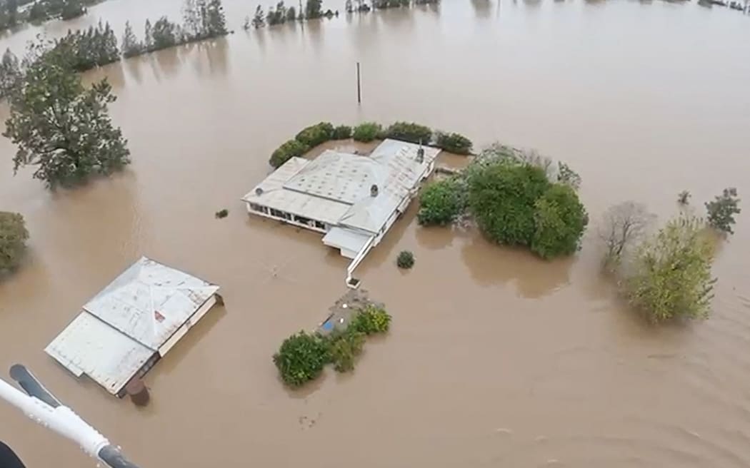 A police helicopter rescue in flooded areas near the NSW town of Taree.