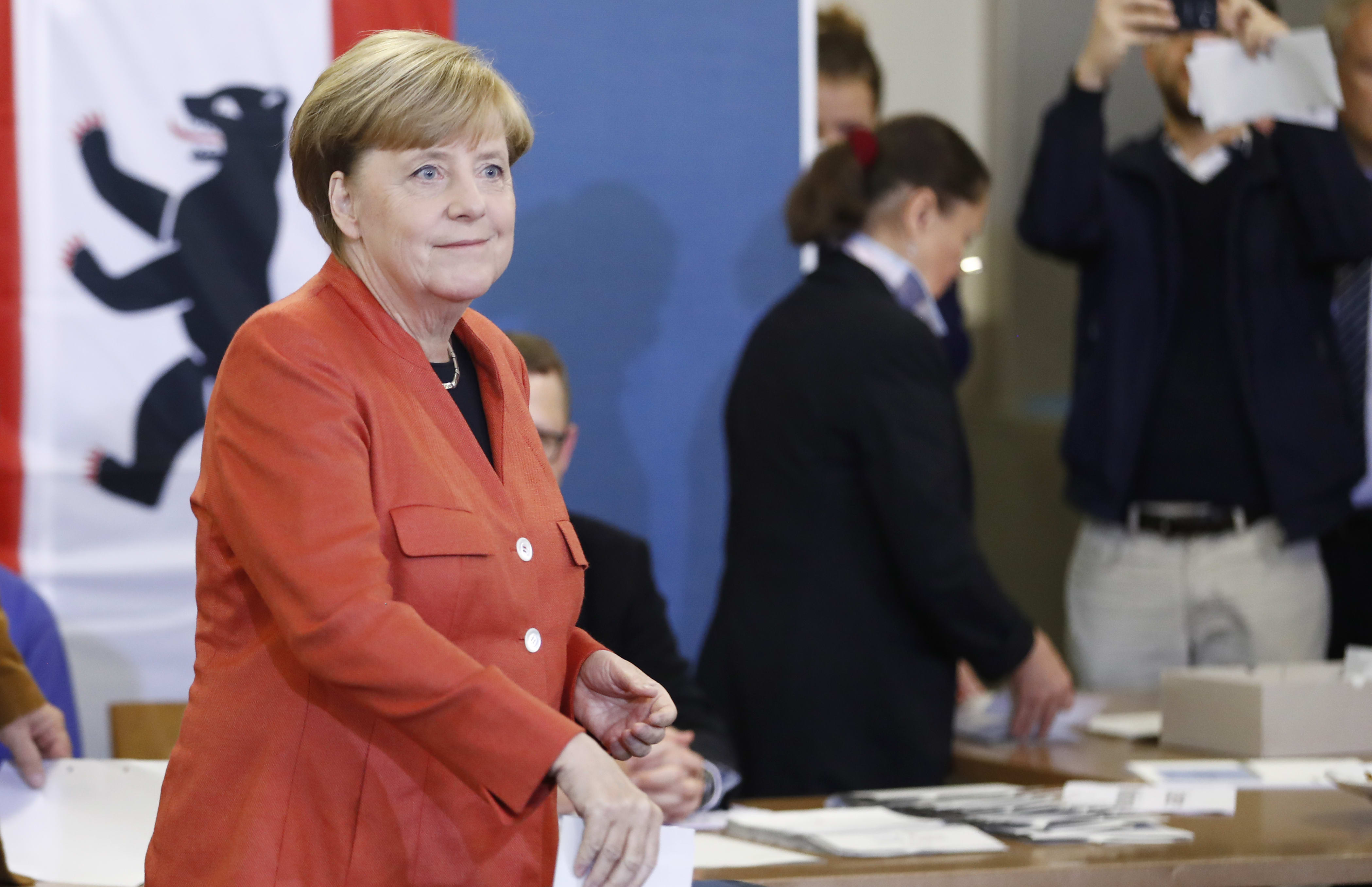 German Chancellor Angela Merkel casts her vote.