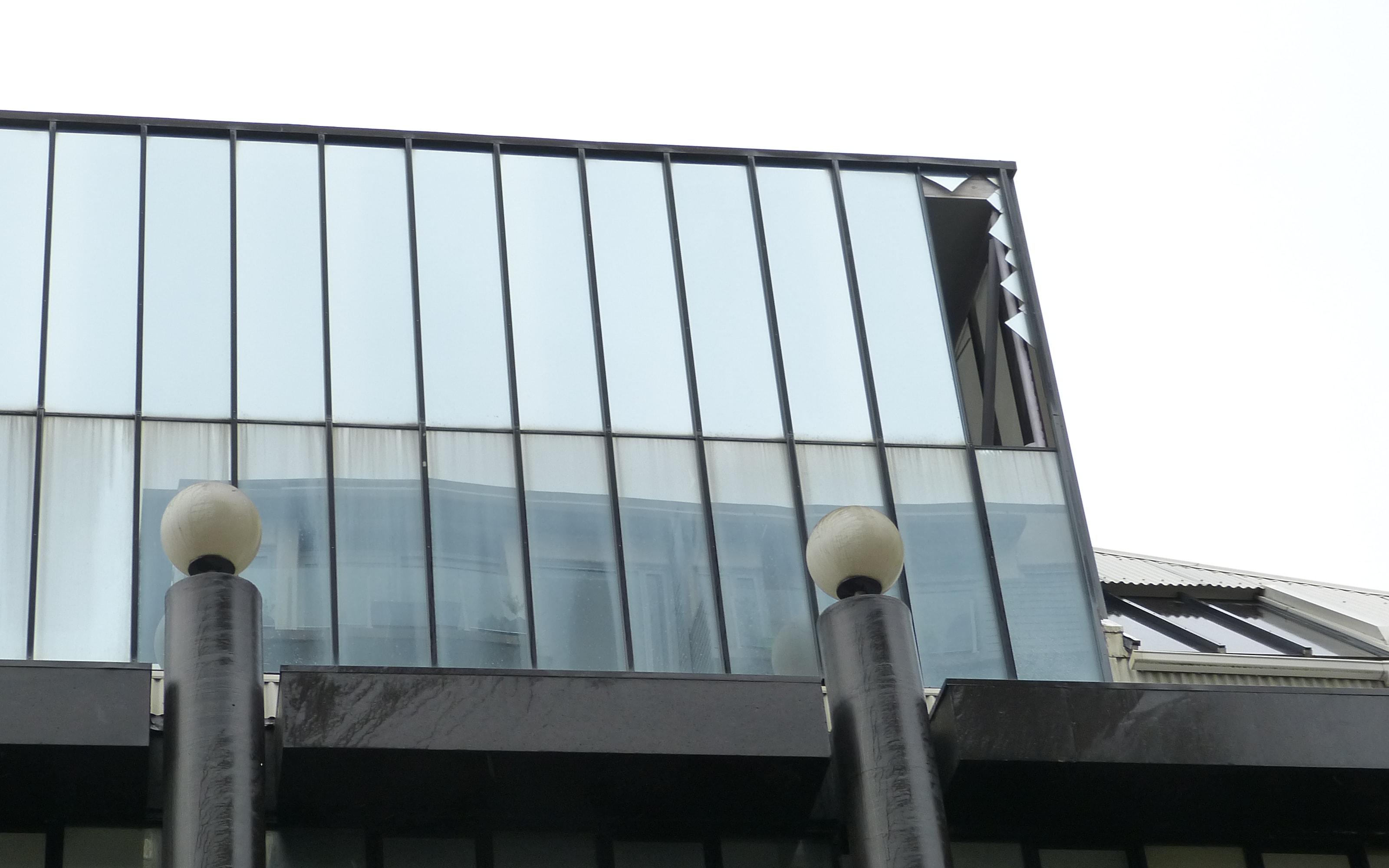 A damaged window can be seen at Whitireia Performing Arts Centre.