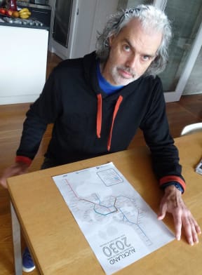 Transport Blog website editor Patrick Reynolds with a map of the group's proposed network.
