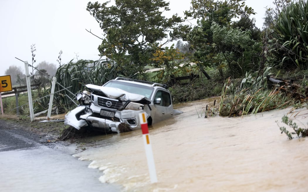 Car written off in flood waters this morning waiting to be towed.