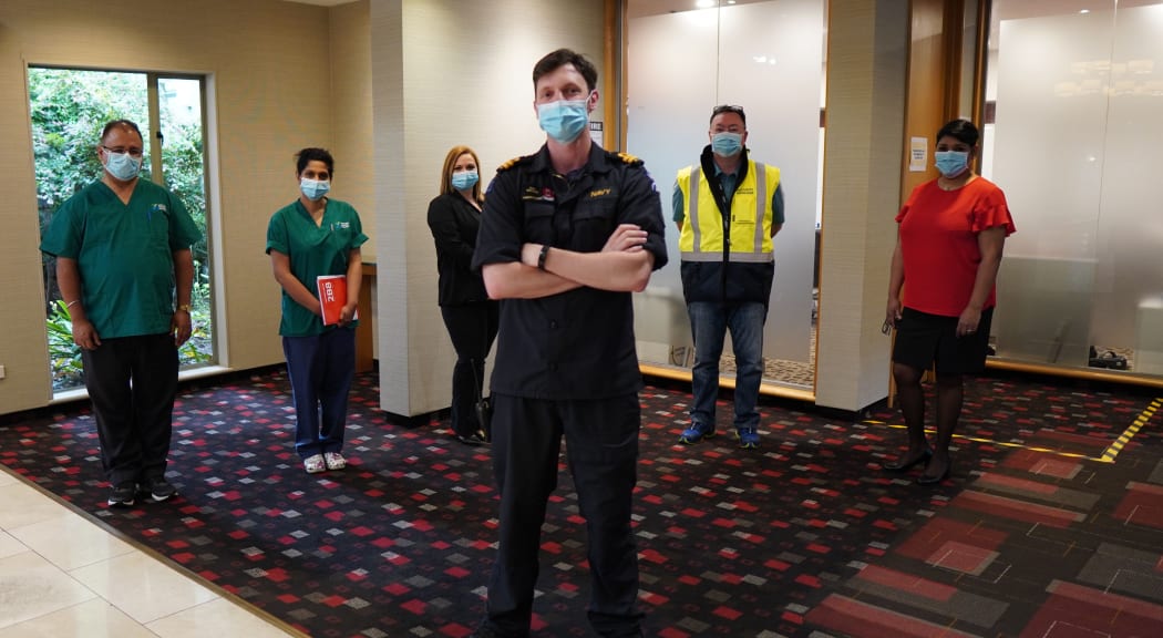 Staff at the Waipuna Hotel, Mt Wellington, Auckland. Several asked for their full names to be protected: (from left) nurses John and Vicki; workforce coordinator Tash, managed isolation facility manager Lieutenant Sam Wilson, site security manager Stuart. and hotel manager Shakira.