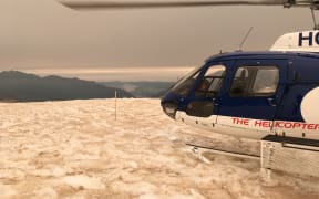 Chancellor Shelf, 1800m above the Fox Glacier, where an orange haze and patches of ash have fallen from the smoke drifting off Australia's bushfires.