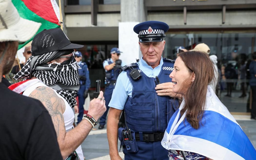 Protesters and counter-protesters outside the Christchurch Town Hall.