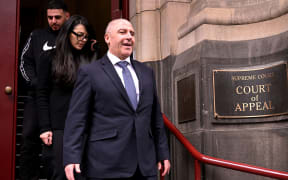 Melbourne gangland personality Tony Mokbel (R) leaves the Victorian Court of Appeal in Melbourne on September 3, 2025. Mokbel is fighting to overturn drug trafficking convictions that saw him jailed for three decades with his legal team argueing he suffered a miscarriage of justice because of the actions of Nicola Gobbo, his former barrister who was a secret police informer. (Photo by William WEST / AFP)