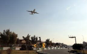 A passenger plane prepares to land at Mehrabad airport in the Iranian capital Tehran.