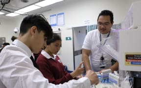 Jared Smiler, a 5th year medicine student at Otago University working with student.