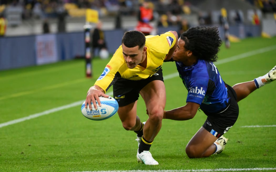 Josh Moorby of the Hurricanes scores a try during the Super Rugby Pacific clash with the Blues at Sky Stadium.