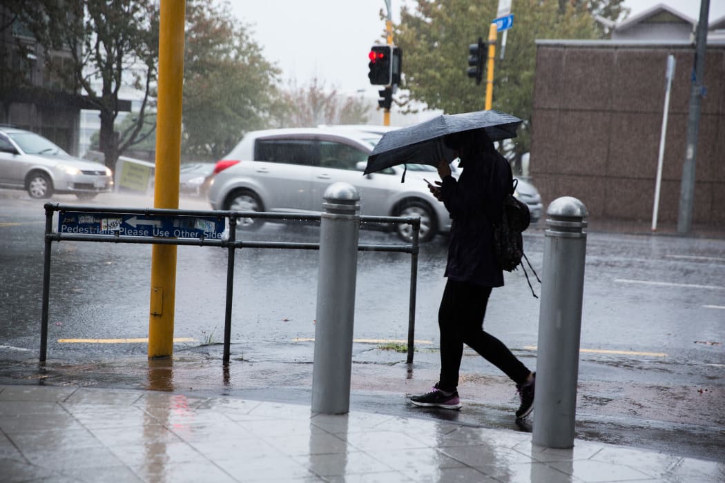 Rain pours down in the Auckland CBD.