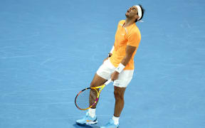 Spain's Rafael Nadal reacts as he competes against Mackenzie McDonald of the US during his men's singles match on day three of the Australian Open tennis tournament in Melbourne on January 18, 2023. (Photo by Martin KEEP / AFP) / -- IMAGE RESTRICTED TO EDITORIAL USE - STRICTLY NO COMMERCIAL USE --