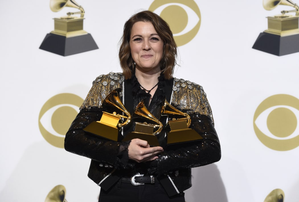 Brandi Carlile, winner of the awards for best Americana album for "By The Way, I Forgive You", best American roots performance for "The Joke", and best American roots song for "The Joke" poses at the 61st annual Grammy Awards at the Staples Center on Sunday, Feb. 10, 2019, in Los Angeles. (