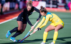 New Zealand's Frances Davies battles for possession with Brooke Peris of Australia during the Tri-Series final in Cromwell.