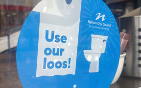 A 'use our loos!' sticker for businesses in Nelson.