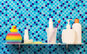 A collection of personal hygiene and body care products, including toothpaste, soap and body wash.